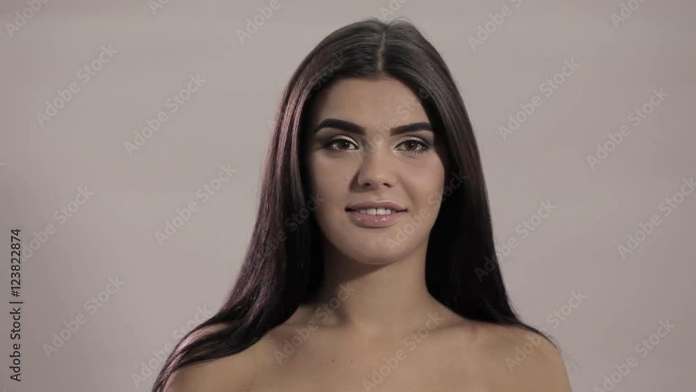Young beautiful woman model with make-up smiling. Portrait of Caucasian appearance, flirting Young beautiful woman model with make-up smiling. Portrait of Caucasian appearance, flirting