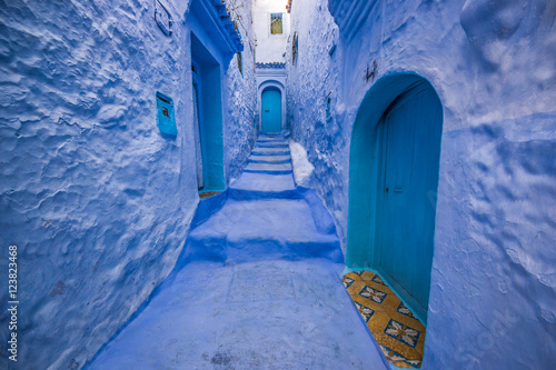 Traditional blue door on an old street inside Medina of Chefchaouen, Morocco © Mariana Ianovska