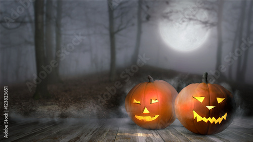 Halloween pumpkin in mist forest. Jack lantern with candle light inside in mystical forest. 3d illustration