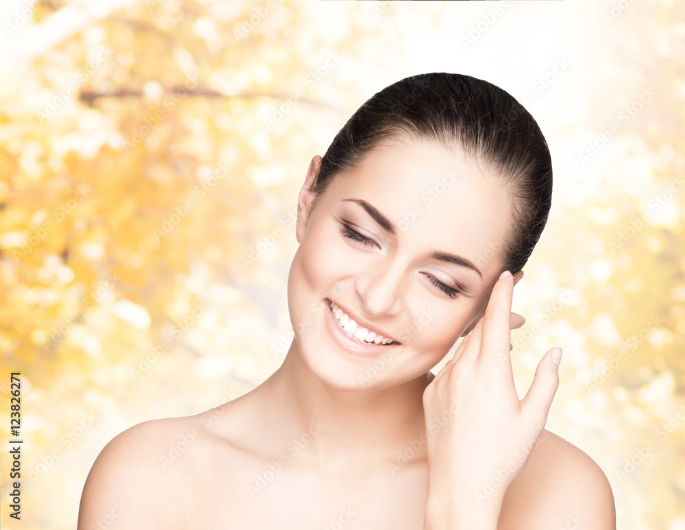 Portrait of a woman in makeup on autumn background Portrait of a woman in makeup on autumn background