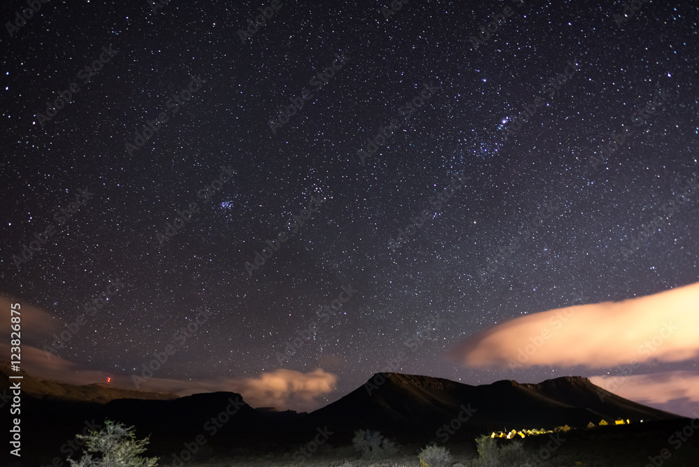 Obraz premium The starry sky captured Karoo National Park, South Africa, in winter. The Pleiades star cluster, Orion and Taurus Constellation clearly visible.