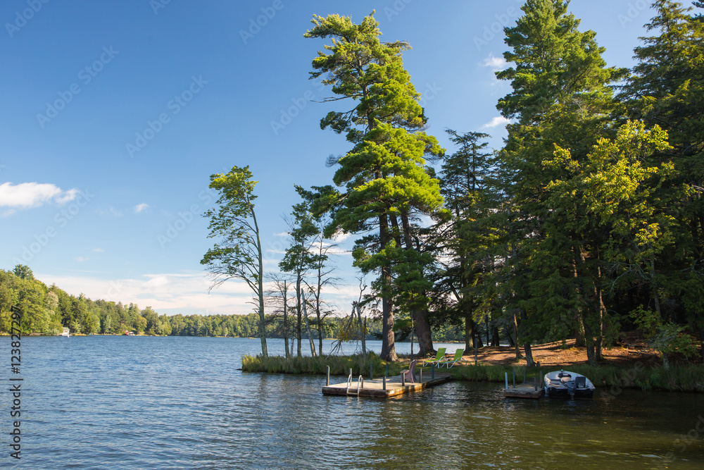 Fototapeta premium Northern Wisconsin lake with boat and pier