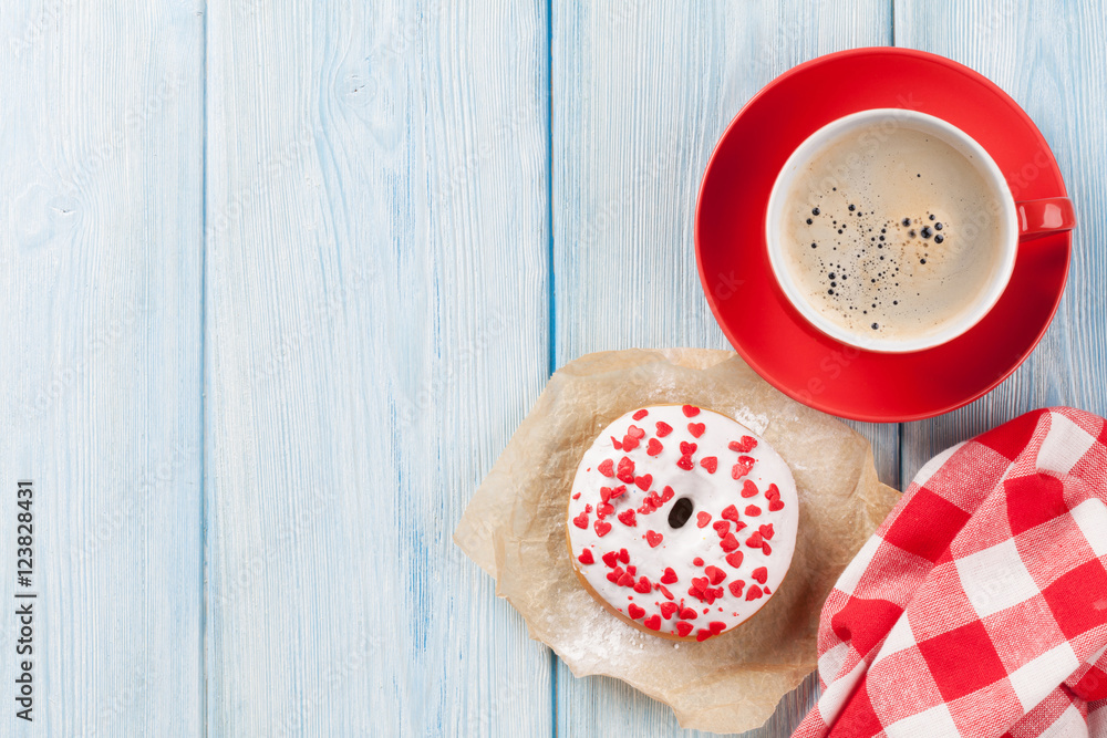 Donut with heart shaped decor and coffee Donut with heart shaped decor and coffee
