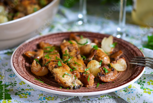 Baked fish with mushrooms, potatoes and onions 