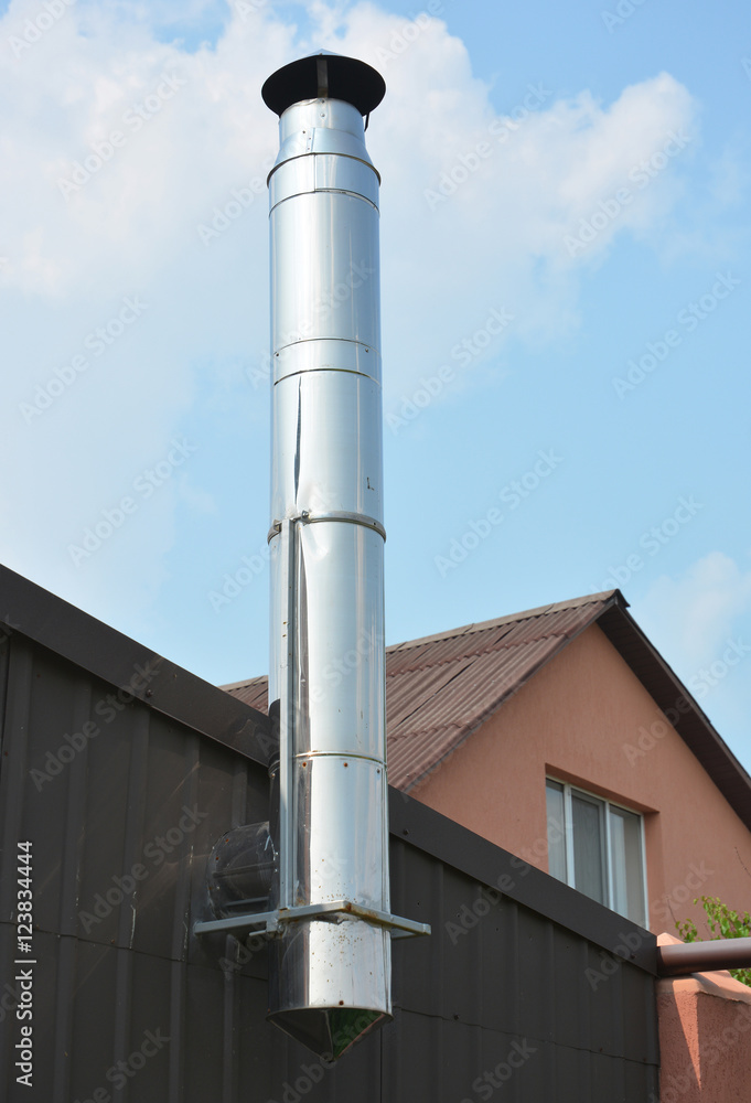 Stainless Steel Chimney. Close up on House Coaxial Stainless Steel Chimney Pipe. Stainless Steel Chimney. Close up on House Coaxial Stainless Steel Chimney Pipe.
