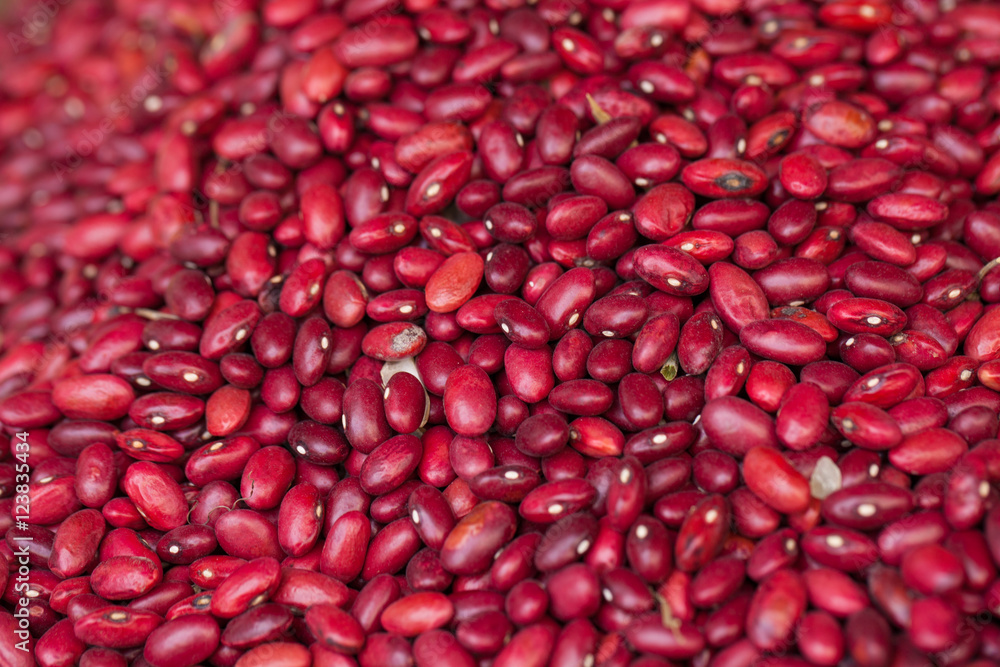 Texture of raw red bean selling on interwoven bamboo basket in fresh local market, Vietnam Texture of raw red bean selling on interwoven bamboo basket in fresh local market, Vietnam