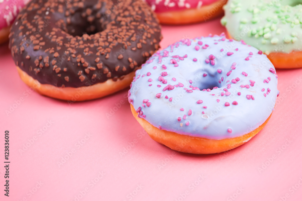 Sweet colorful tasty donuts on pink background. Sweet colorful tasty donuts on pink background.