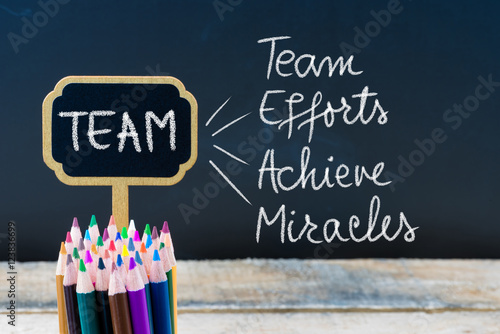 Obraz na płótnie Business Acronym TEAM as Team Efforts Achieve Miracles written with chalk on wooden mini blackboard labels w salonie