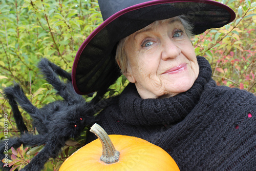 halloween old woman with a pumpkin