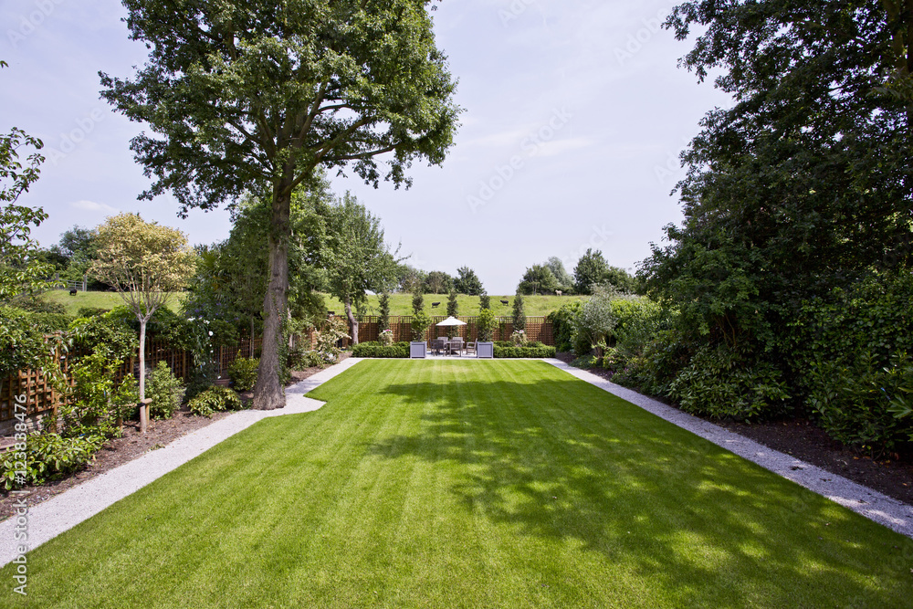 Fototapeta premium massive garden with perfectly trimmed lawn