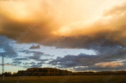 Dark stormy clouds over field