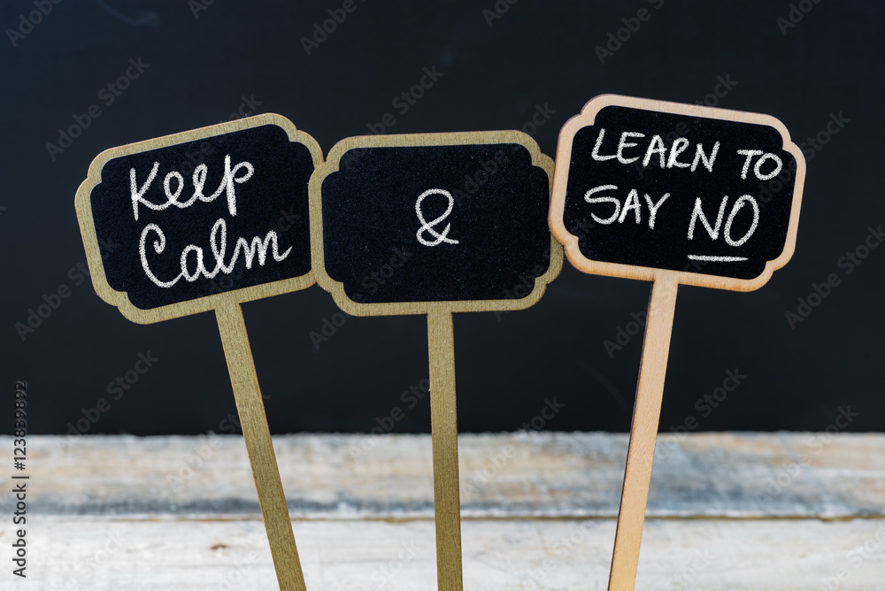 Keep Calm and Learn To Say NO message written with chalk on mini blackboard labels