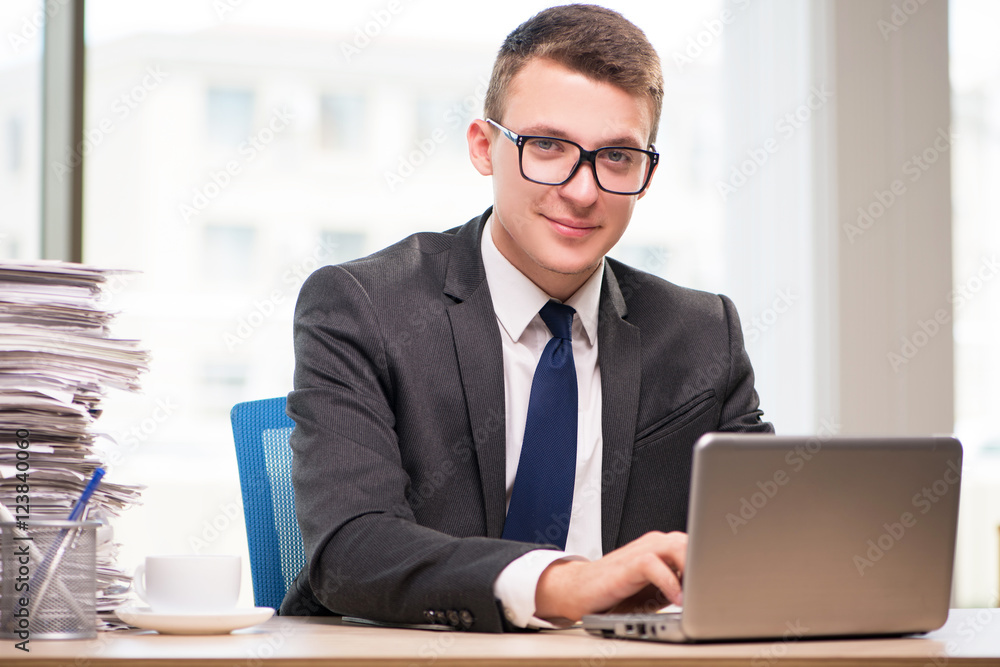 Businessman working with much paperwork Businessman working with much paperwork