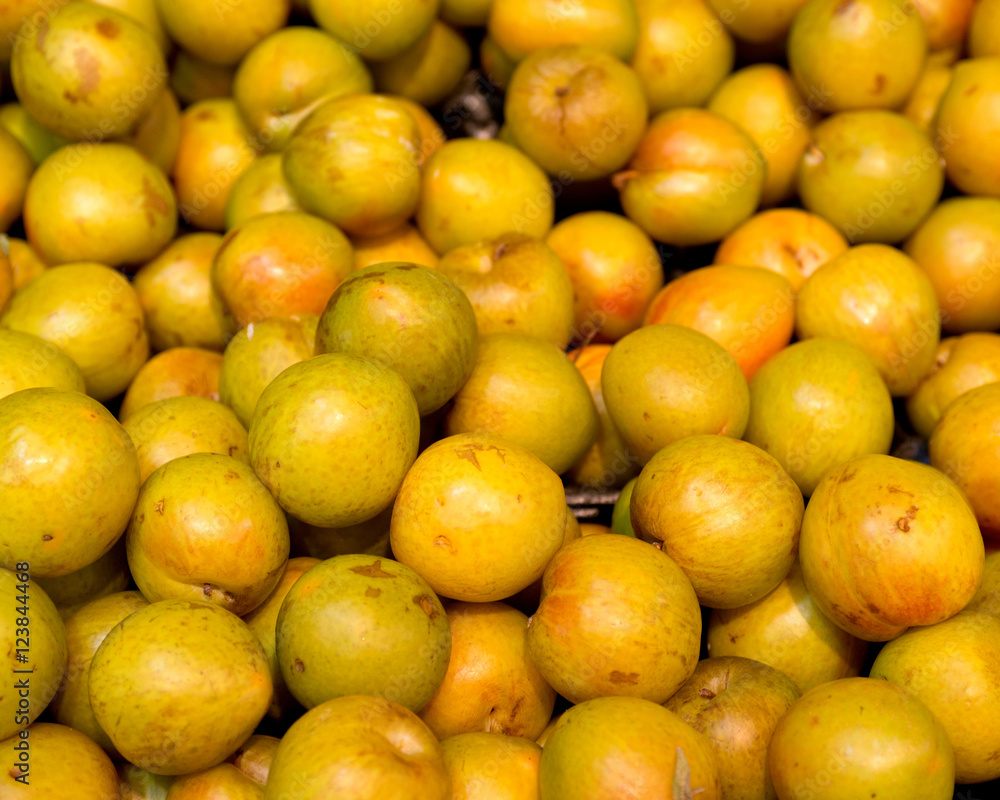 Fresh organic yellow plums in local fresh market store