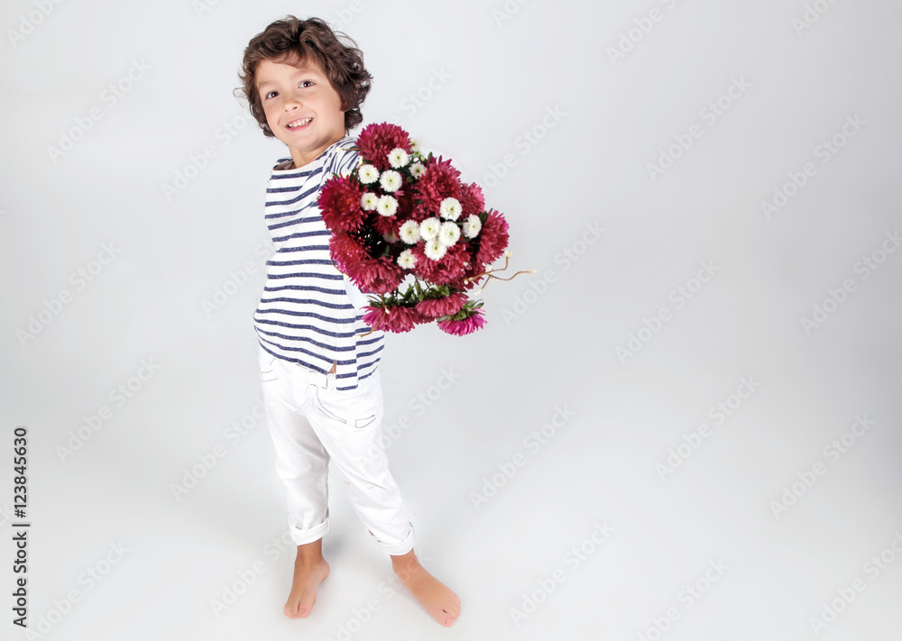 Cute and funny little boyin stripe shirt with flowers over white Cute and funny little boyin stripe shirt with flowers over white