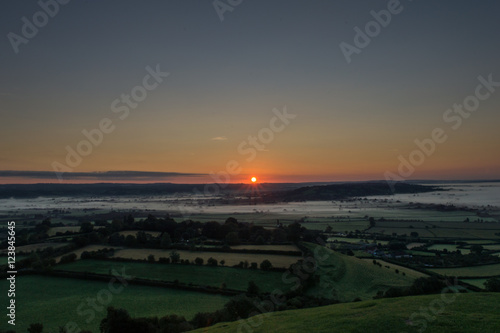 Sunrise over misty fields of Somerset