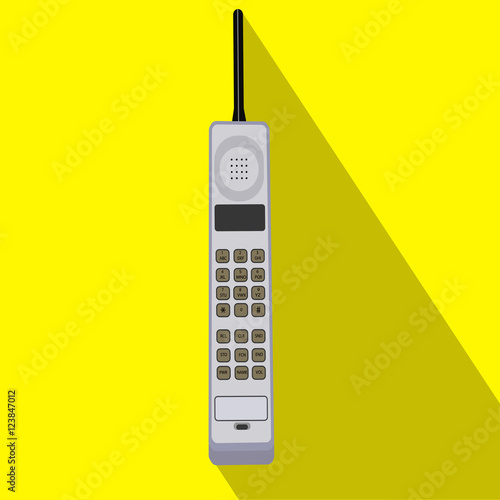 Retro mobile phone. Flat style design with long shadow.