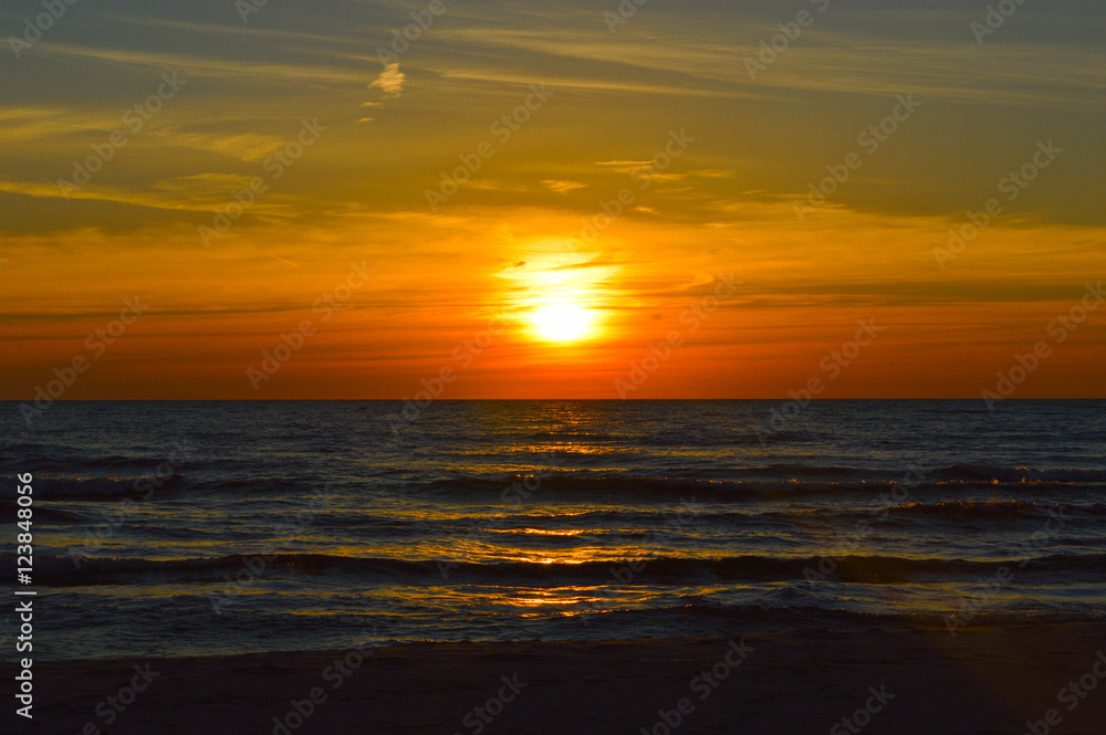 Brilliant sunrise over the waters of lake Huron in Oscoda, Michigan