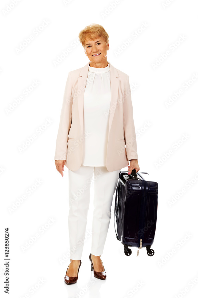 Smile senior woman with suitcase Smile senior woman with suitcase