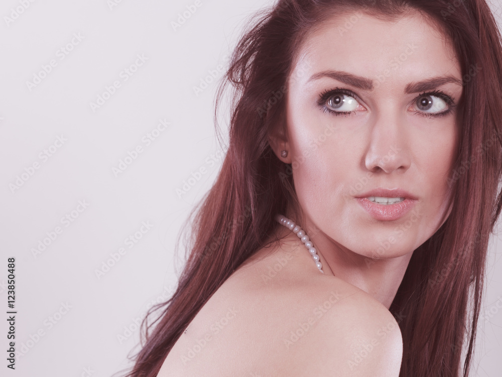 Brunette long hair woman wearing pearls necklace Brunette long hair woman wearing pearls necklace