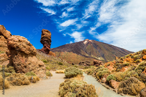 Roques de Garcia stone and Teide mountain volcano at the sunny morning in the Teide National Park, Tenerife, Canary Islands, Spain. photo