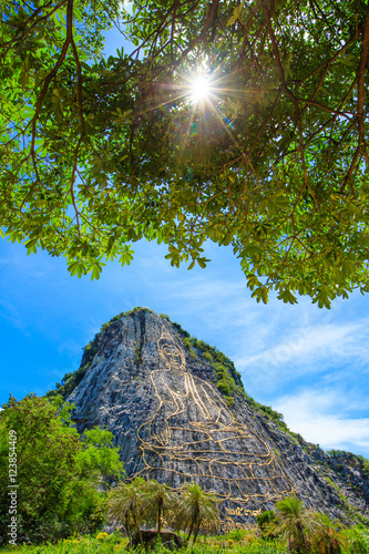 Khao chee chan the largest buddha carved in the world with trees photo