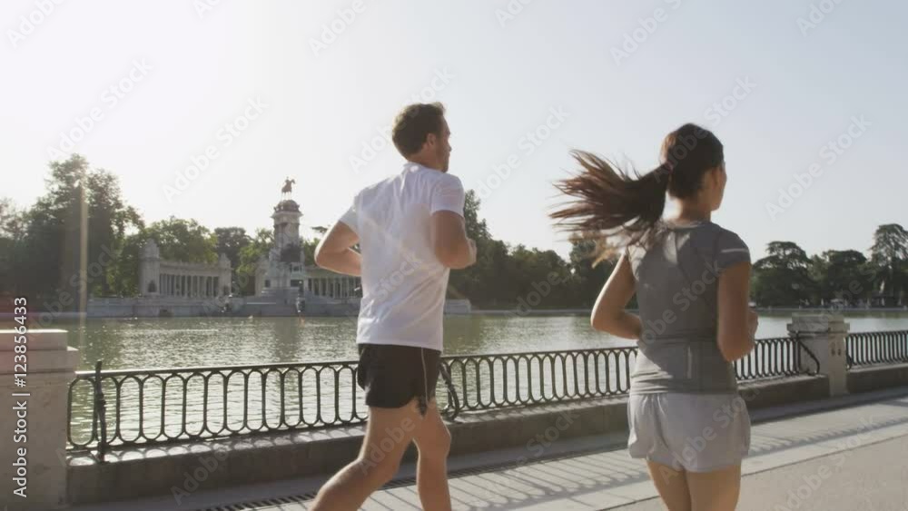 Jogging runners jogging running in Madrid El Retiro city park