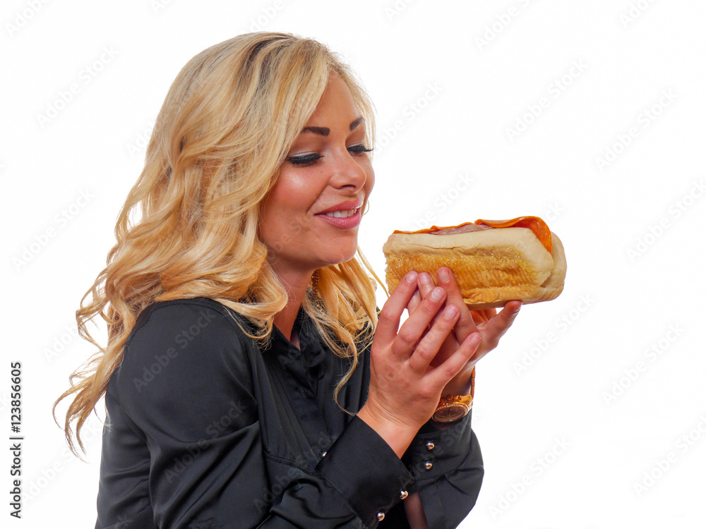 Blond woman looking at a deli sandwich. Blond woman looking at a deli sandwich.