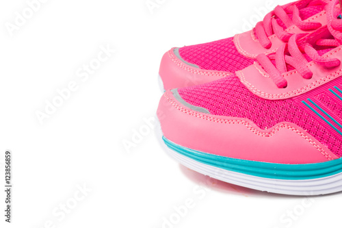 Pink sport shoes on white background 