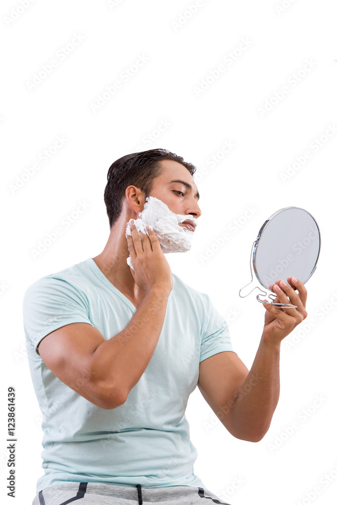 Handsome man shaving isolated on white background Handsome man shaving isolated on white background