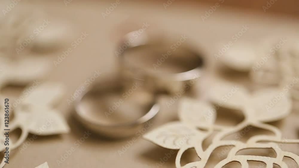Wedding rings rotating with textured background Wedding rings rotating with textured background