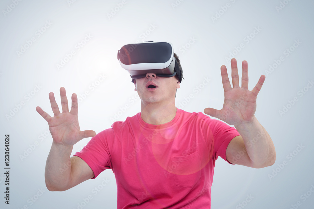 Man wearing virtual reality goggles. Surprise and delight Man wearing virtual reality goggles. Surprise and delight