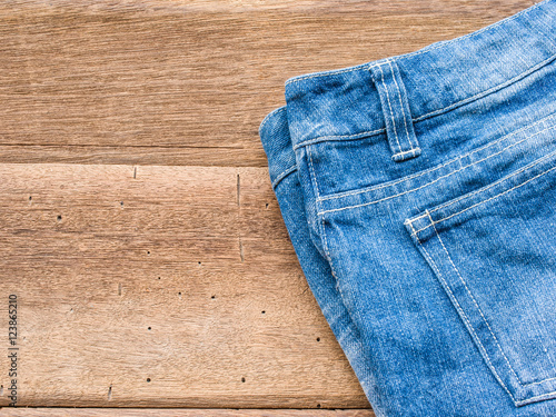 Short jean on wood background
