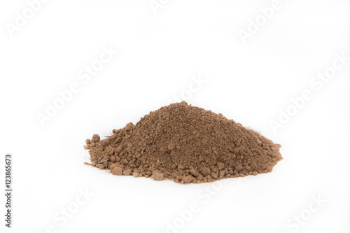 Pile of brown soil on white background