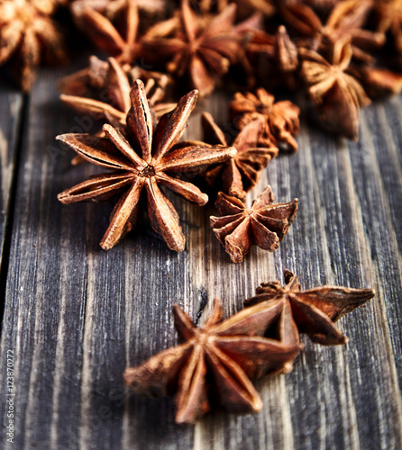 Heap of anise stars on wooden table