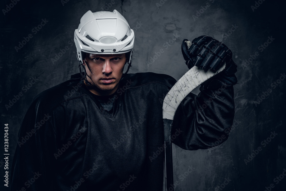 Fototapeta premium Portrait of hockey player with the gaming stick.