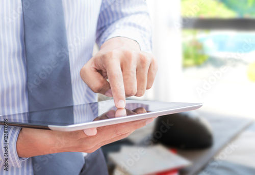 businessman touching tablet