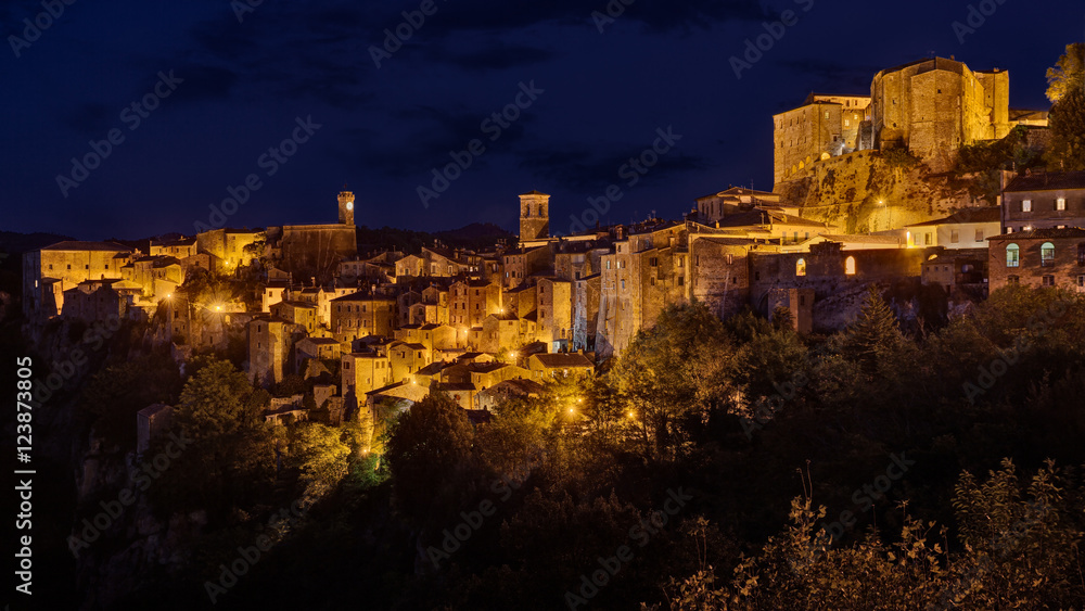 Sorano, Grosseto, Tuscany, Italy: night landscape of the picturesque medieval village on the hill
