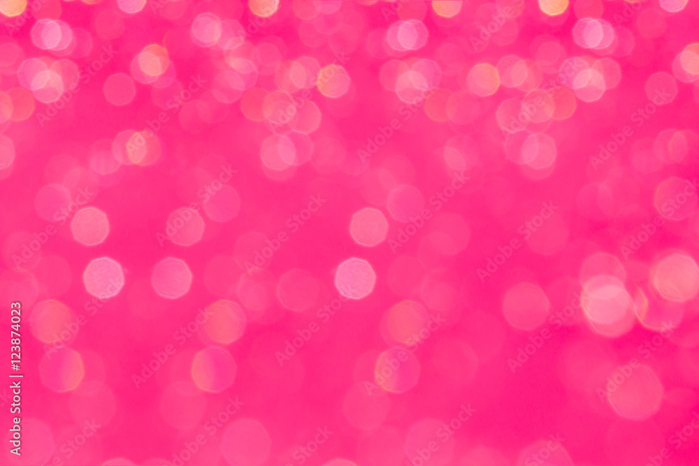 Bokeh glamour pink background with blurred rainbow lights. Festive background.