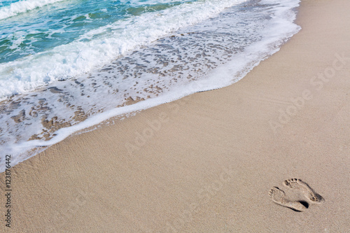 Footprints in the sand at the beach