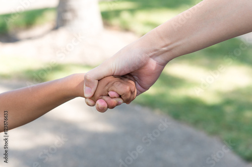 little boy and girl holding hands