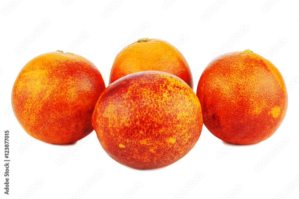 Ripe red blood oranges isolated on white background. Closeup. Ripe red blood oranges isolated on white background. Closeup.