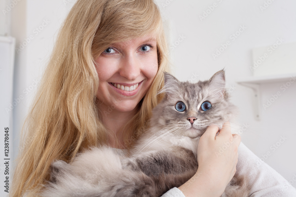 young woman holding ragdoll cat young woman holding ragdoll cat