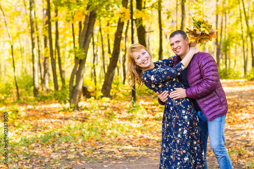 love, relationship, family and people concept - couple in autumn park