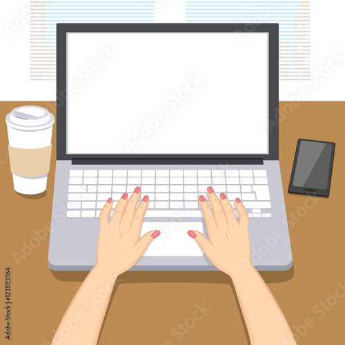 Woman hands writing working on laptop with coffee cup and smartphone on table