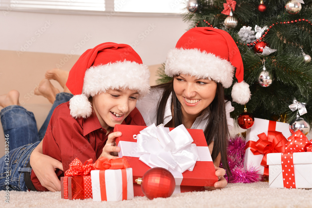 mom and son in santa hats mom and son in santa hats