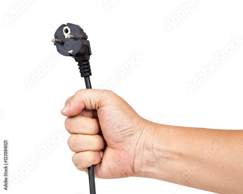 Hand holding a black electric plug isolated on white background