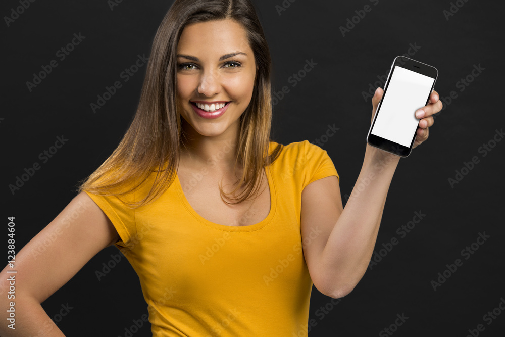 Naklejka premium Beautiful girl with a smartphone