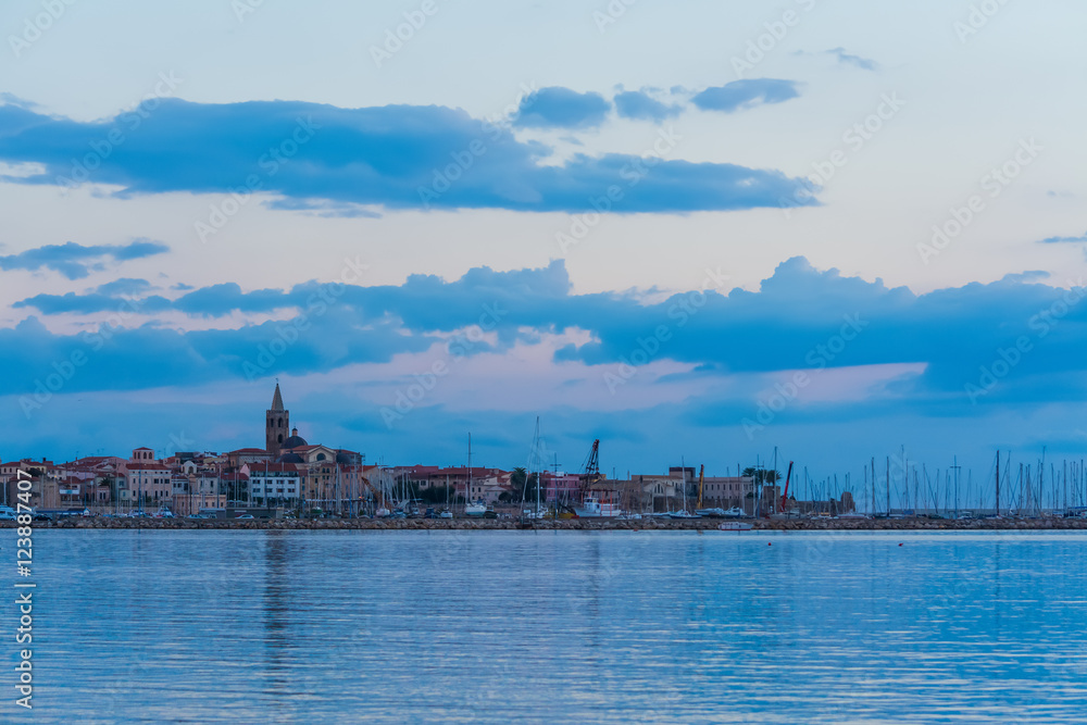 Alghero under a blue sky at sunset Alghero under a blue sky at sunset