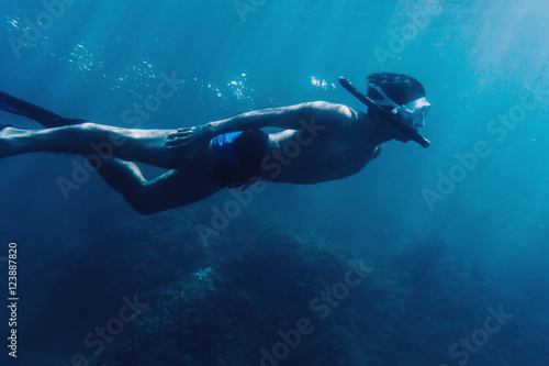 Male diver snorkeling underwater